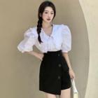 Set: Short-sleeve V-neck Blouse + Wrap A-line Skort