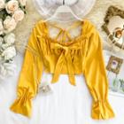 Long-sleeve Bow-accent Cropped Top
