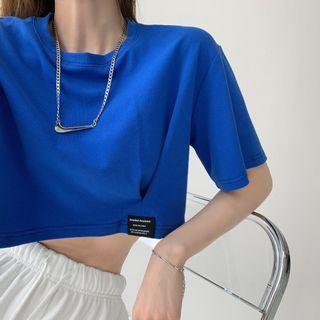 Details Labeled Loose-fit Crop T-shirt