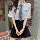 Short-sleeve Letter Embroidered Shirt / Plaid Neck Tie / Pleated A-line Skirt / Set