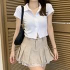 Button-up Cropped T-shirt / Pleated Mini A-line Skirt
