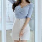 Set: Short-sleeve V-neck Knit Top + Mini Fitted Skirt