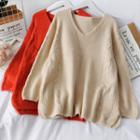Loose-fit V-neck Cable Sweater